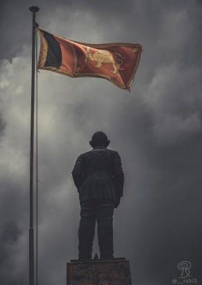 The Sri Lankan flag waving above the statue of Don Stephen Senanayake, the father of the nation and the first prime minister of independent Ceylon ( Sri Lanka).
